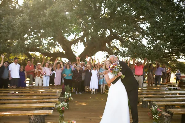 The bride walking the aisle with her father
