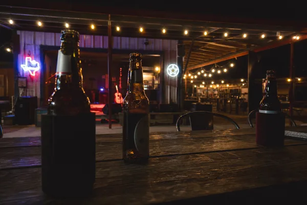 A Texas country beer joint under string lights
