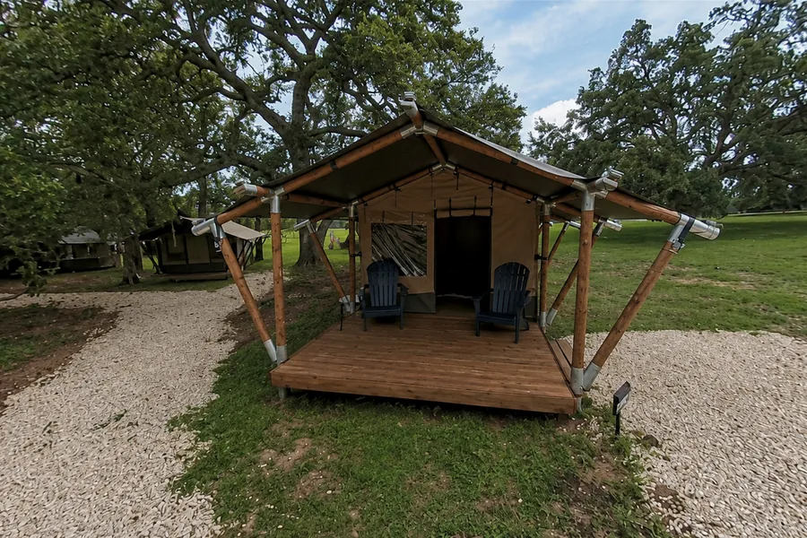 Safari glamping tent on a wooden deck