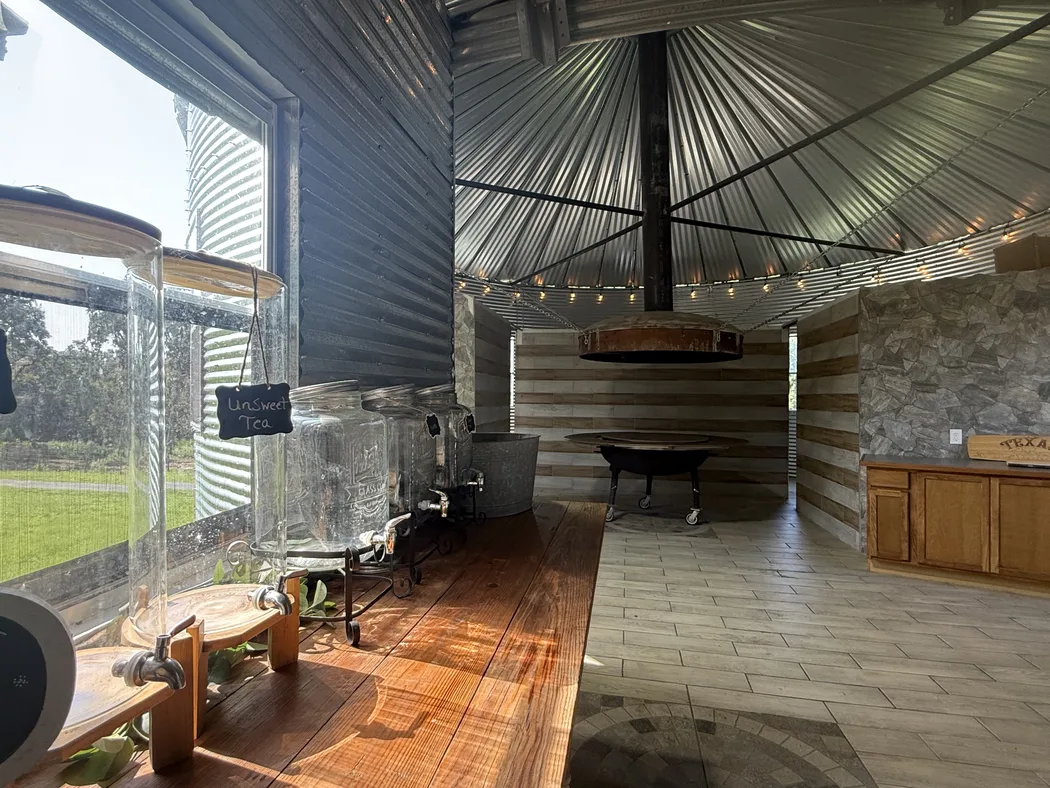 The round grill house with its central fire pit and string lights