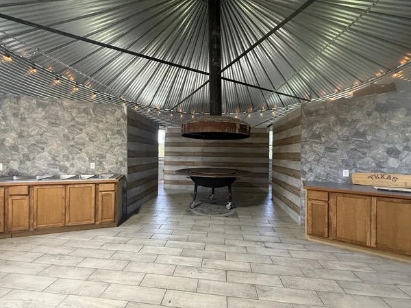 Counters and cabinets around the grill house