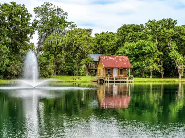 Cabin on the lake with fountain