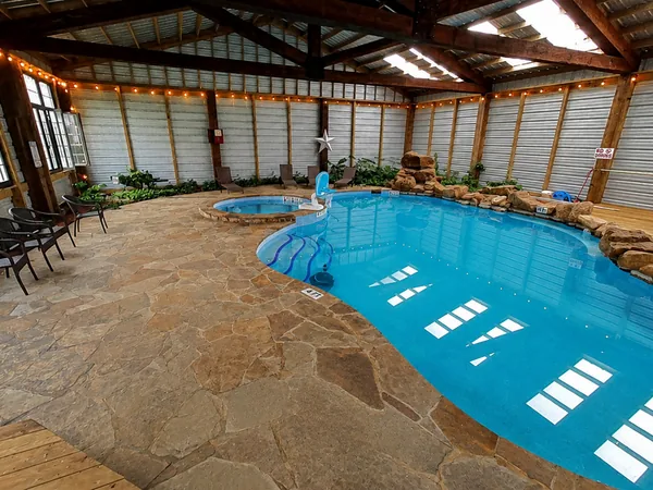 Indoor pool with rock walls