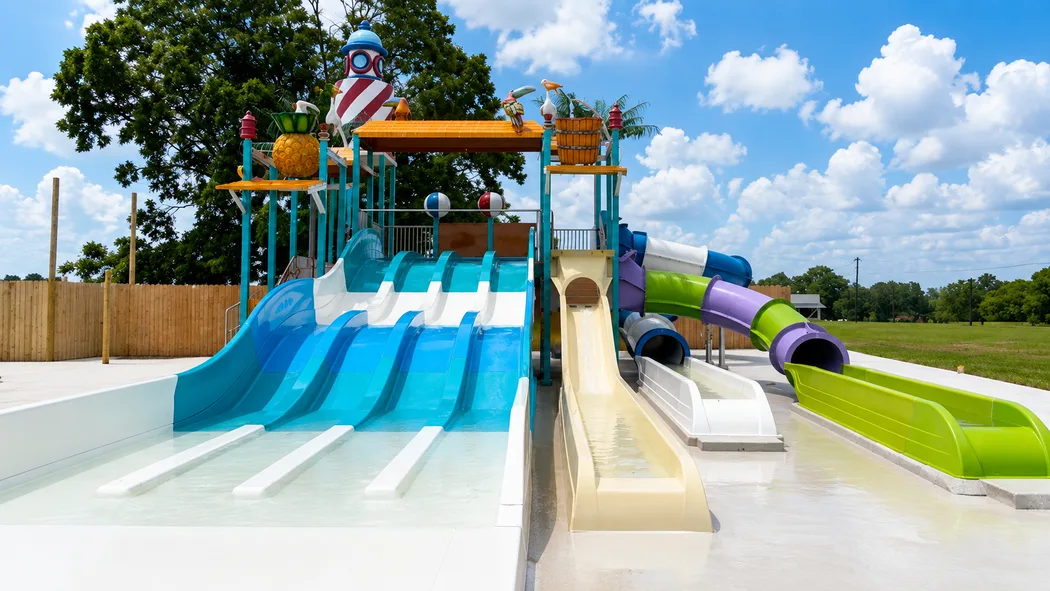 The multi-lane water slide tower against a big Texas sky